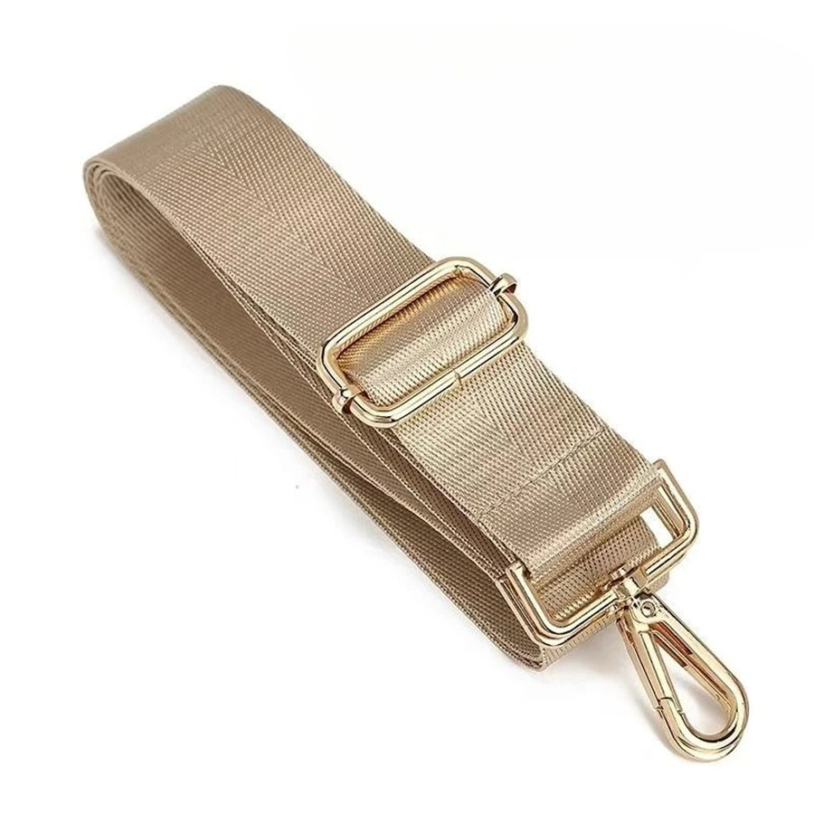 A beige nylon adjustable shoulder strap with a gold-toned buckle and lobster clasp.