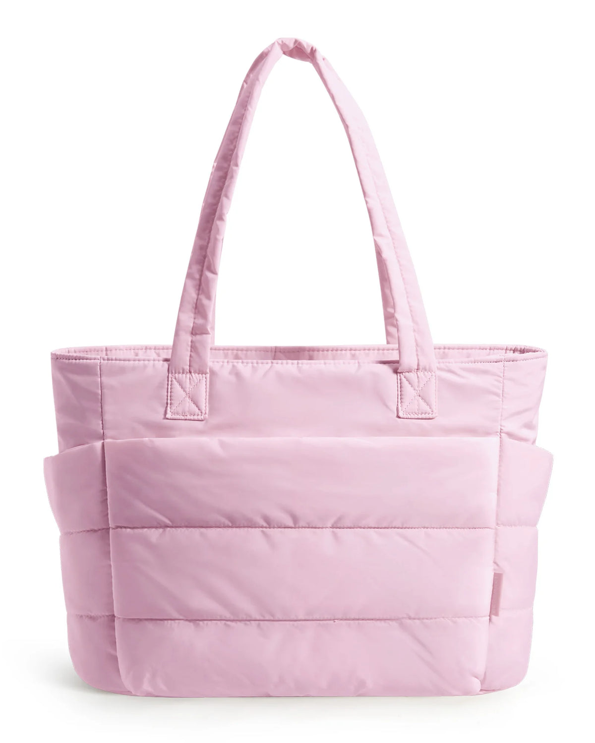 A light pink quilted tote bag with a handle is shown against a white background.