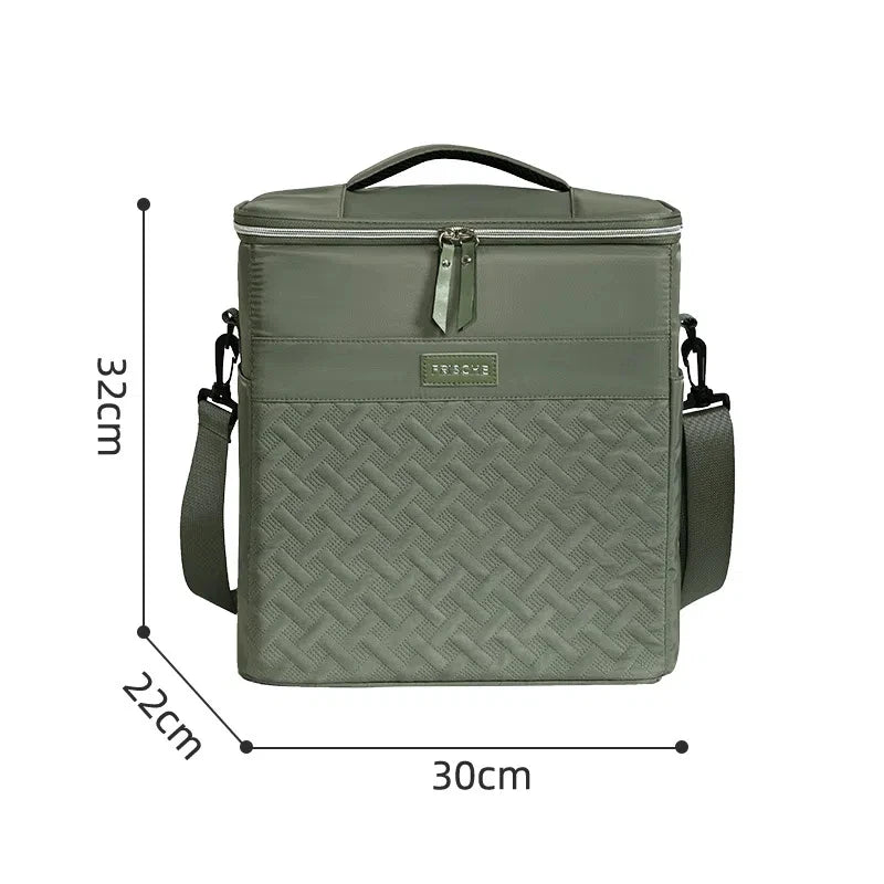 A olive green insulated picnic cooler backpack with a top handle and shoulder straps.