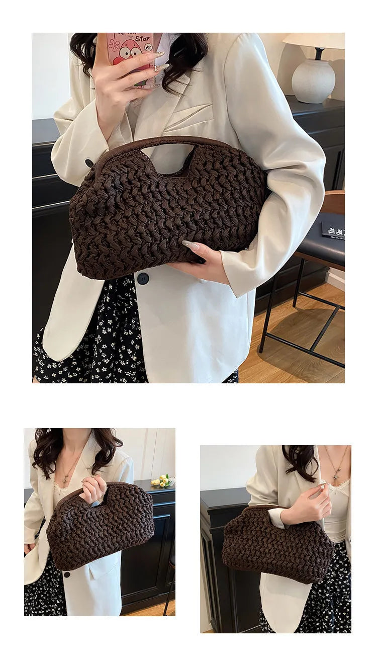 A close-up of a dark brown straw woven tote handbag being held by a woman in a white blazer.