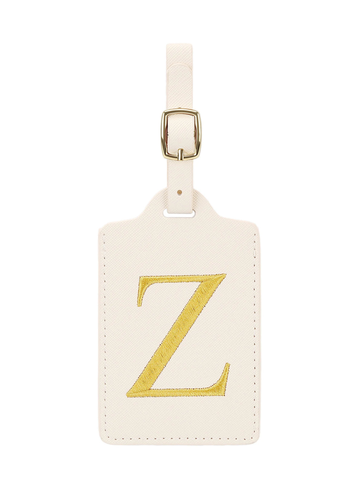 Étiquette de bagage beige en cuir rectangulaire avec un Z brodé en or et une pince métallique argentée.