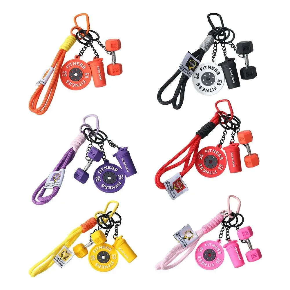 A collection of colorful fitness dumbbells and weights attached to keychains.