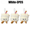 Three white bread plush keychains with striped straws hanging from a keyring.