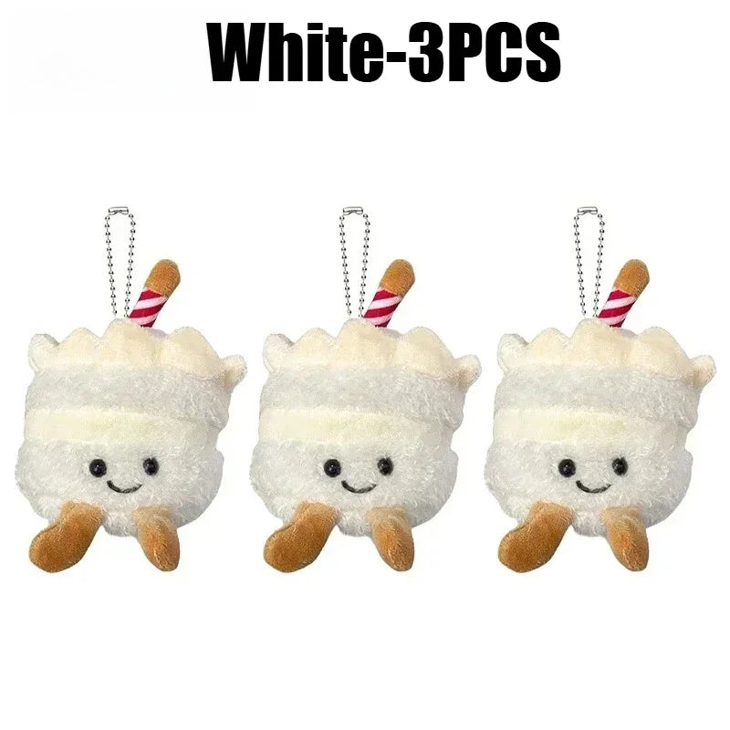 Three white bread plush keychains with striped straws hanging from a keyring.