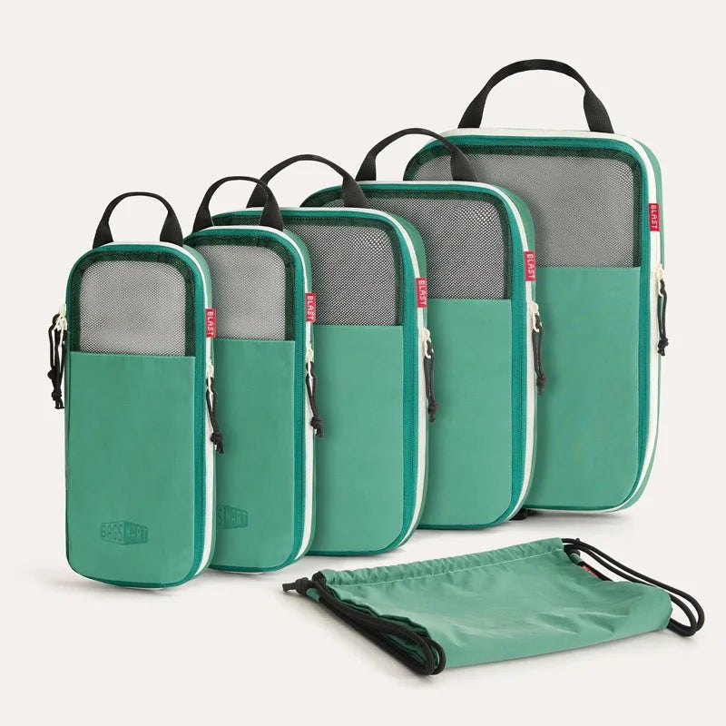 A set of six teal packing cubes with black handles and gray compression fabric are displayed on a white background.