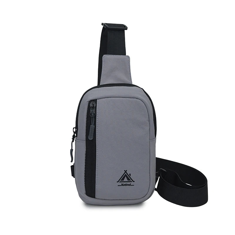 Gray nylon sling crossbody bag with black strap and adjustable buckle
