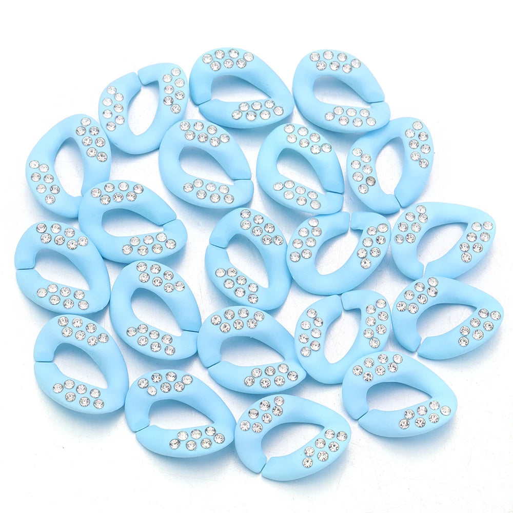 A collection of light blue acrylic link chain connectors for DIY jewelry and bag making