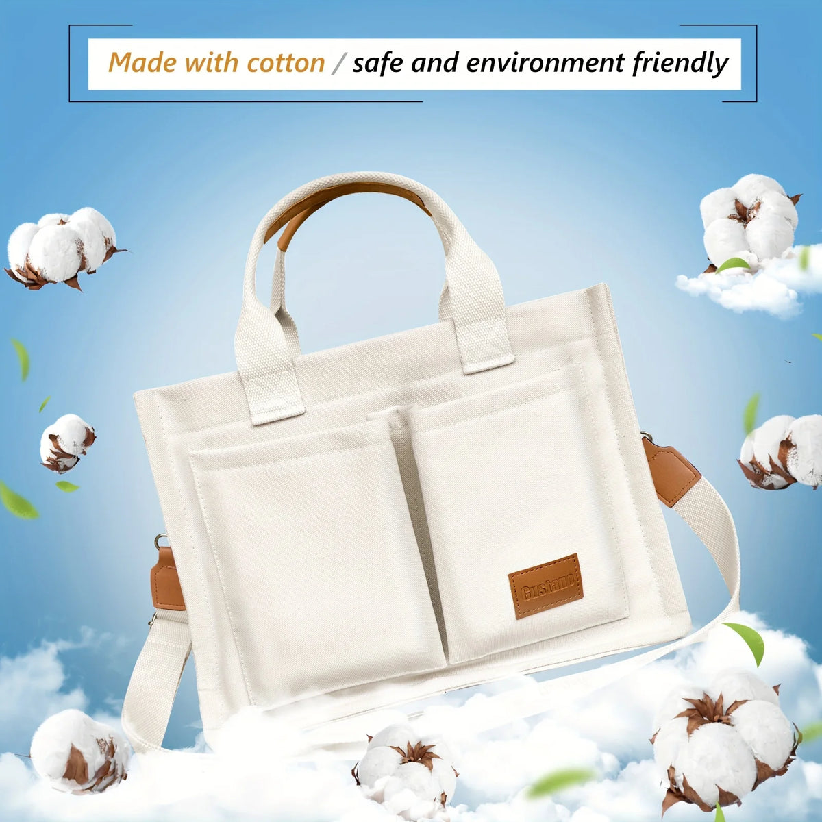 A cream canvas tote handbag with leather accents is shown against a light blue sky with fluffy white clouds and cotton bolls.