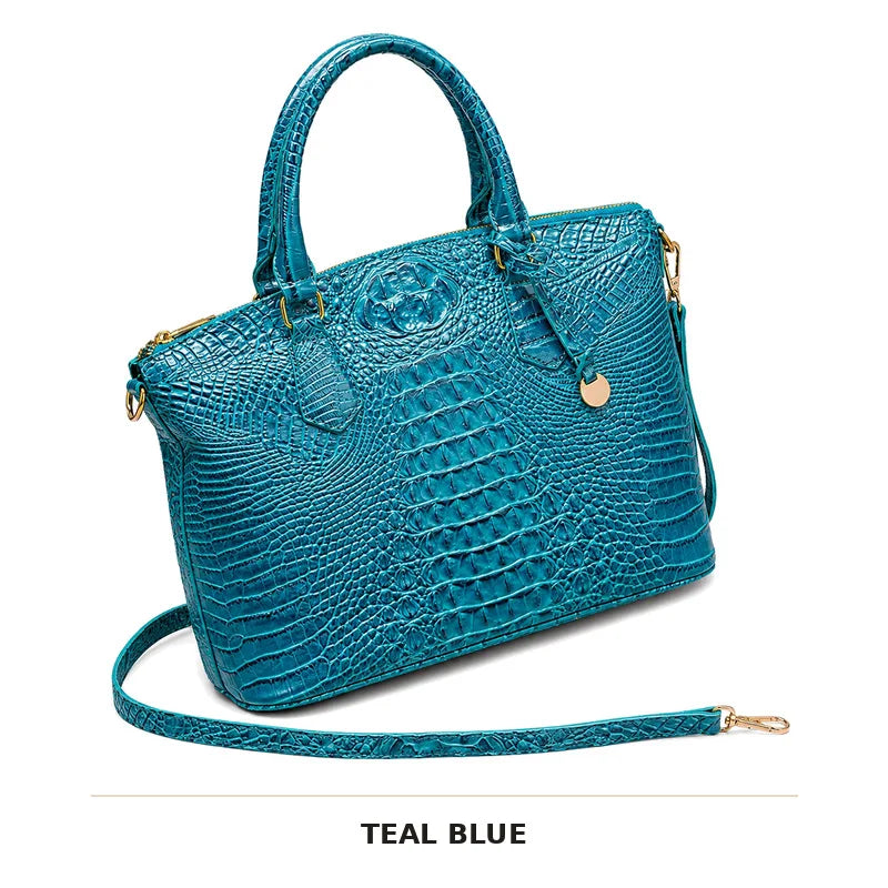 Türkisblaues Krokodilmuster-Top mit Henkel und Crossbody-Tasche in Gold-Hardware.