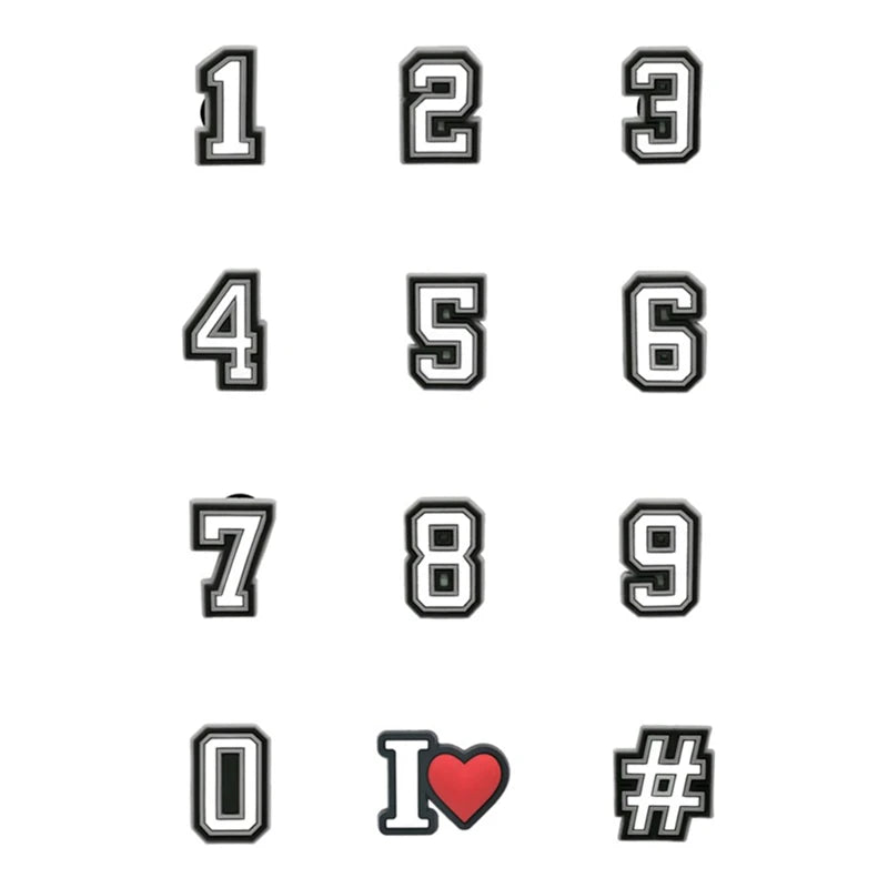 A set of decorative shoe charms and pins shaped like numbers 1 through 9 and the letter I with a heart and a hash symbol.