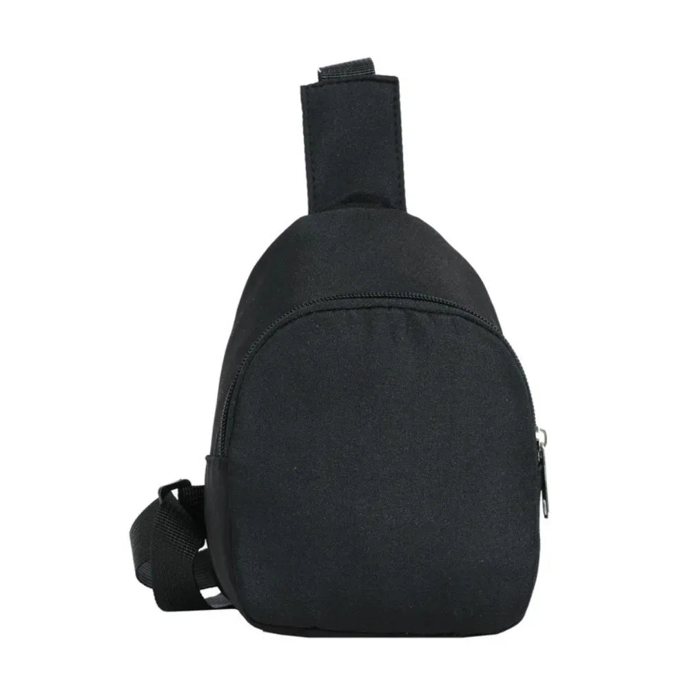 Black nylon crossbody bag for kids with a strap and zipper.