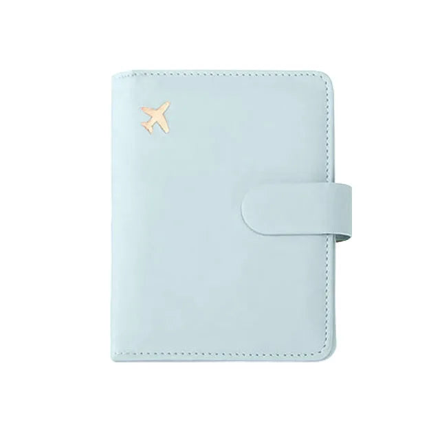 Light blue RFID-blocking travel passport organizer with a card slot and a flap.