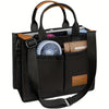 Black canvas tote handbag with brown leather accents and a fan inside