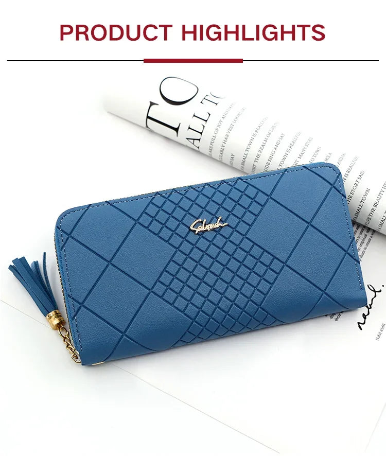 A navy blue quilted PU leather clutch wallet with gold hardware and a tassel, shown against a white background.