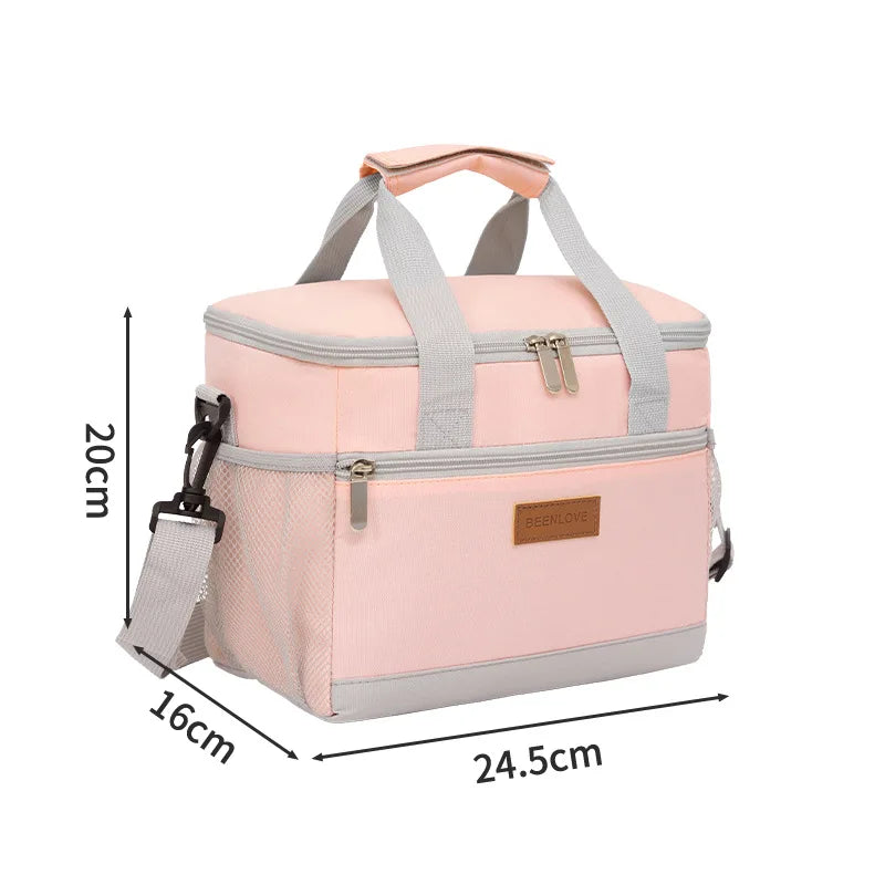 A pink insulated thermal lunch bag with gray straps and a beige accent tag.