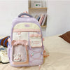 A light purple and pink Candy Color Campus backpack with a padded front pocket and decorative details.