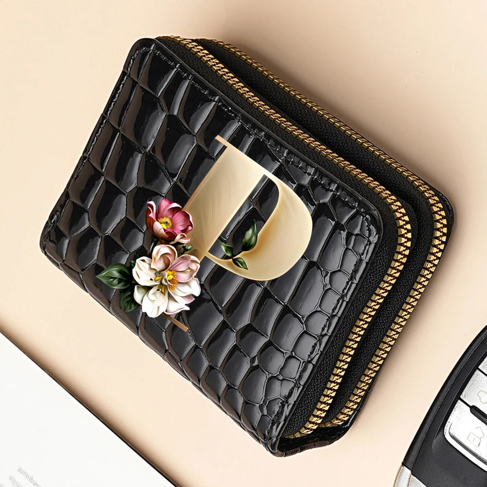 Black PU leather double-zip clutch wallet with a gold zipper and a light yellow cartoon print detail.