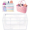 A pink waterproof transparent beach bag organizer with dividers holding various items like towels and accessories.