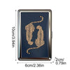 A vintage snap metal card holder featuring a gold-colored leopard print design on a dark blue background.