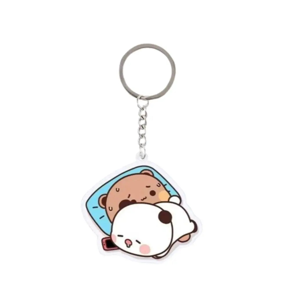 A clear resin keychain charm featuring a cute cartoon design of a panda face.