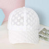 White summer floral mesh snapback baseball cap shown on a light surface.