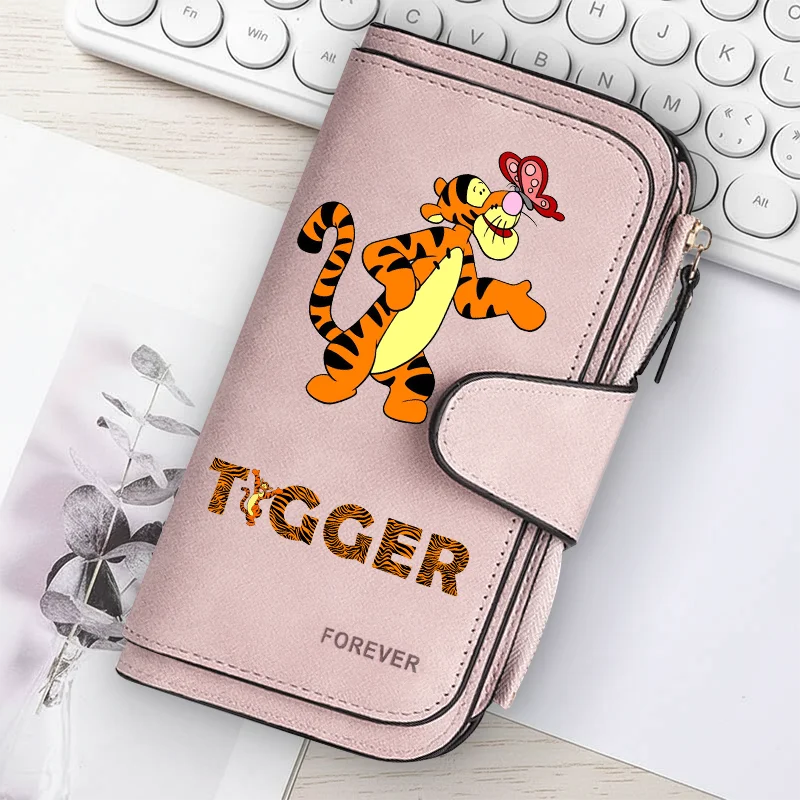 A pink women's long zipper handbag coin purse featuring an orange and black tiger illustration and the word forever.