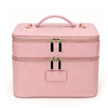 A pink double-layer makeup storage case with a handle and gold zippers.