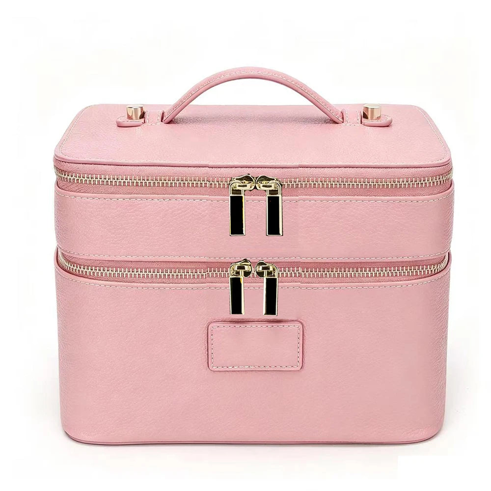 A pink double-layer makeup storage case with a handle and gold zippers.