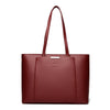 A deep burgundy leather shoulder bag with a long handle shown against a white background.