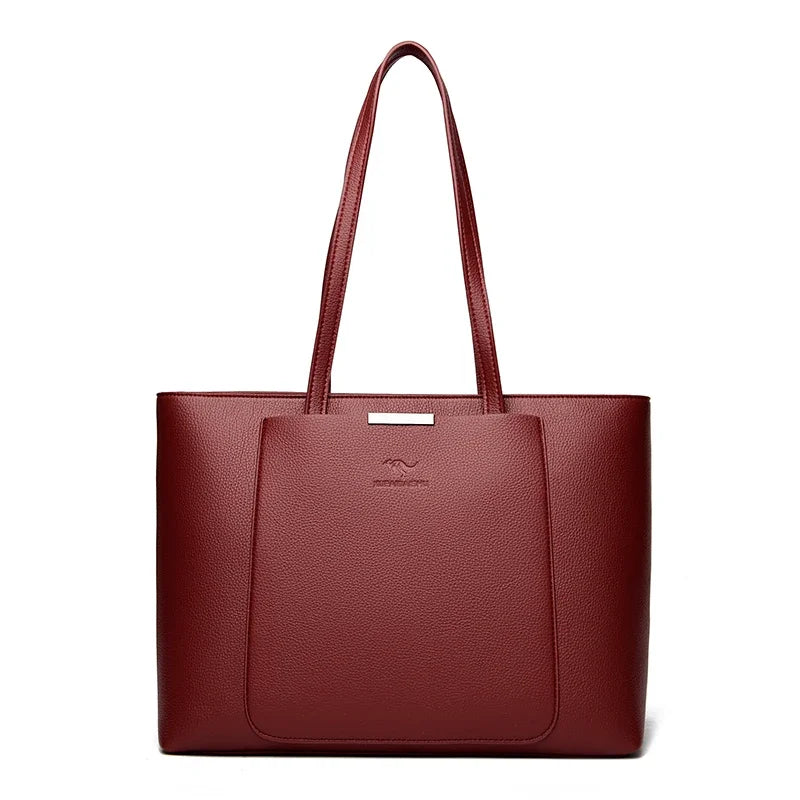 A deep burgundy leather shoulder bag with a long handle shown against a white background.