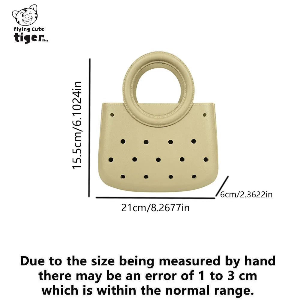 A light beige round PVC handbag featuring a perforated or hole design.