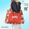 A red Miffy folding shopping bag is shown being carried by a person against a light blue background.
