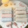 A collection of quilted storage bags in various pastel colors and patterns for hair dryers and personal items.