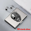 Silver card holder wallet with a detailed skull design and matching stud earrings.