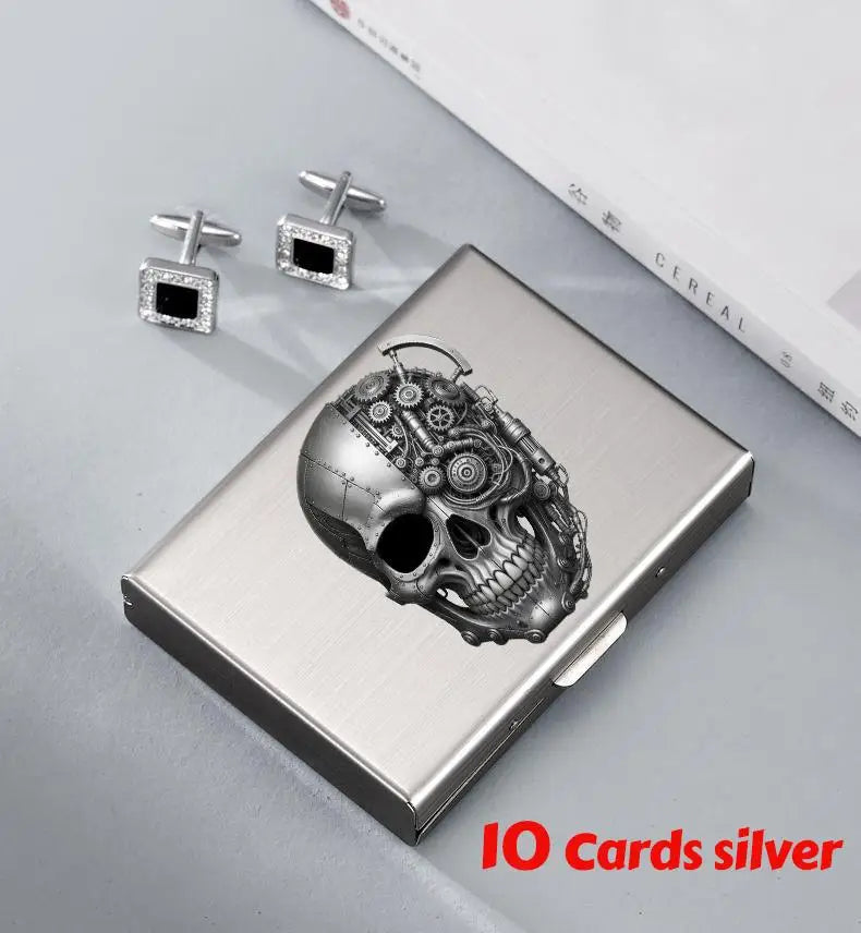 Silver card holder wallet with a detailed skull design and matching stud earrings.