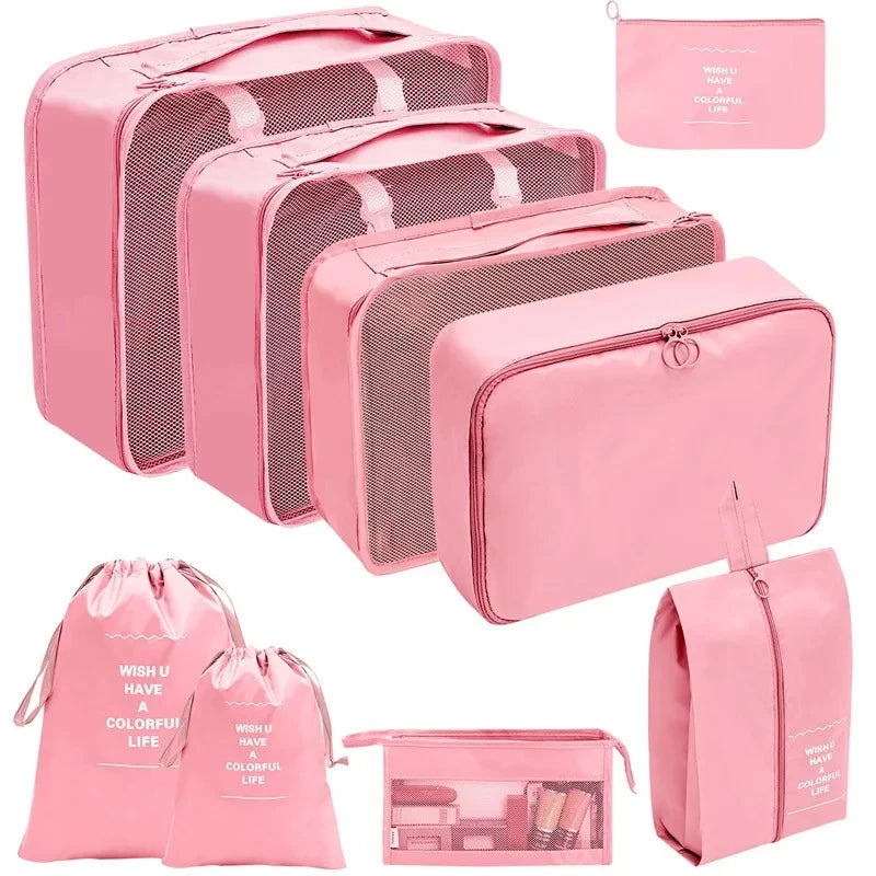 A set of pink fabric storage organizers and pouches for organizing various items.