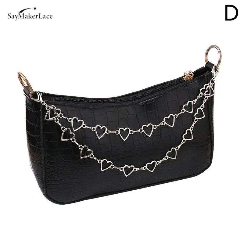 Black faux leather shoulder bag with a silver chain strap and gold hardware