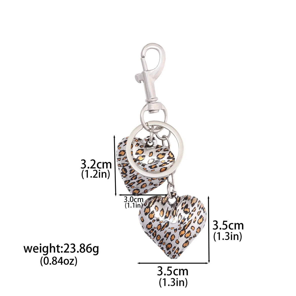 Silver keychain featuring a leopard print heart charm and bow design
