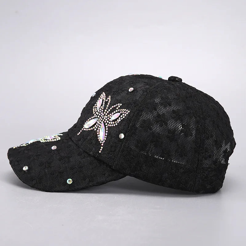 Black mesh snapback baseball cap decorated with a silver floral embroidery.