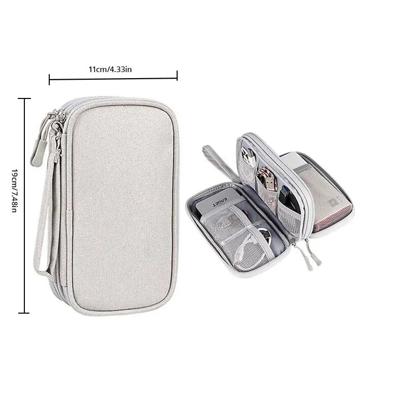 A light gray portable digital accessory organizer pouch with a zipper and strap.