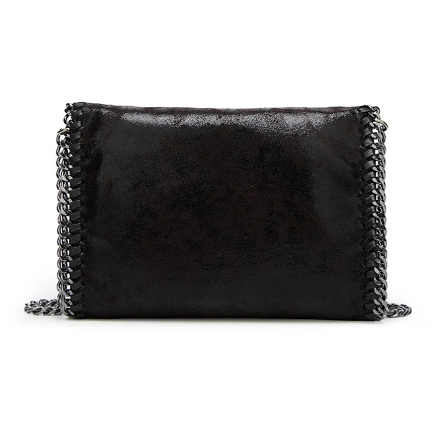 Black vintage flap crossbody bag with a silver chain strap.