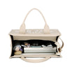 Sac tote designer en PU beige avec une sangle beige clair et une organisation intérieure.