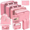 A set of pink fabric storage organizers including a large box, several zippered pouches, and a flat pouch.
