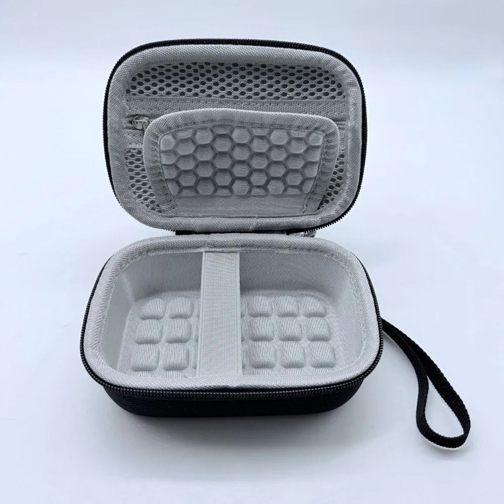 A gray and black durable EVA hard shell camera case shown open, displaying molded foam inserts.