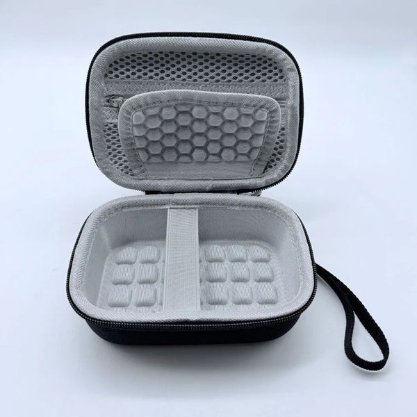 A gray hard shell case for a digital camera, shown open with internal foam padding.