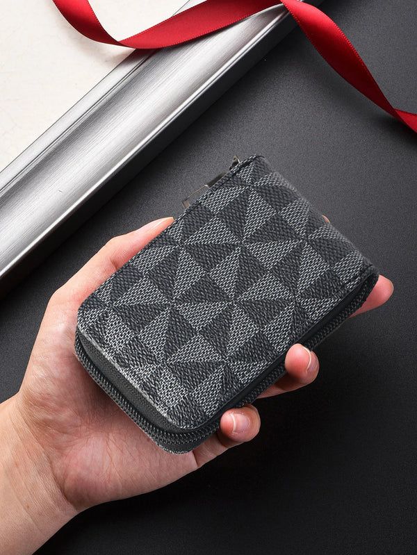 A hand holds a dark gray men's PU card holder with a zipper closure against a black background.
