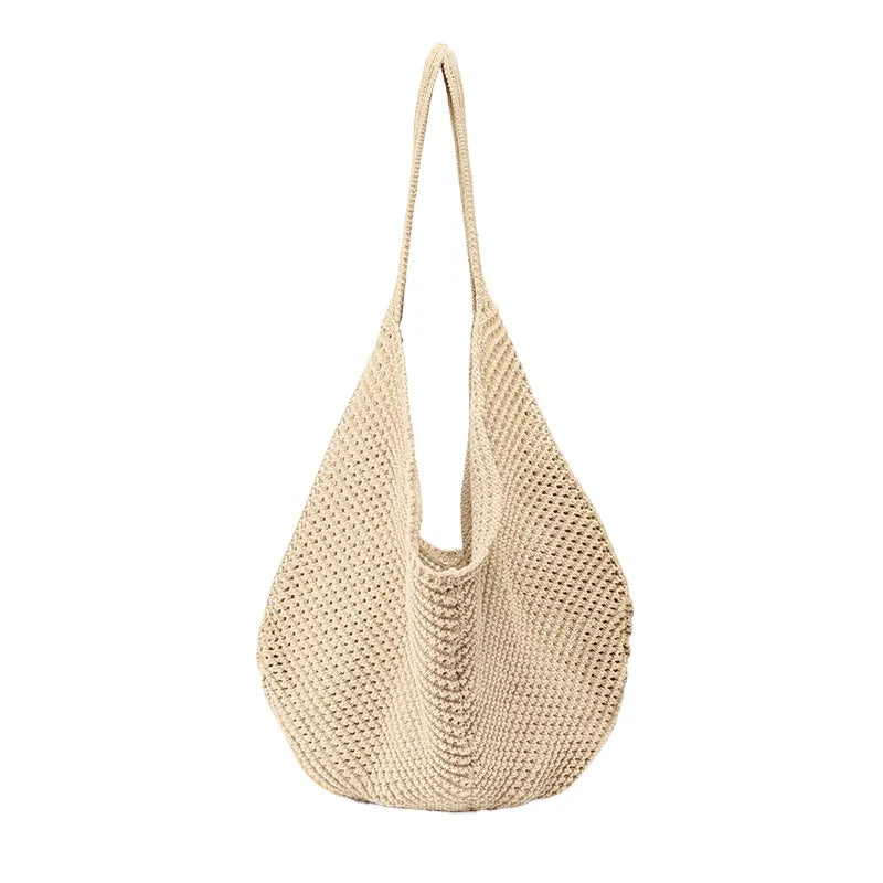 A beige crochet shoulder bag with a mesh detailing, shown from the front.