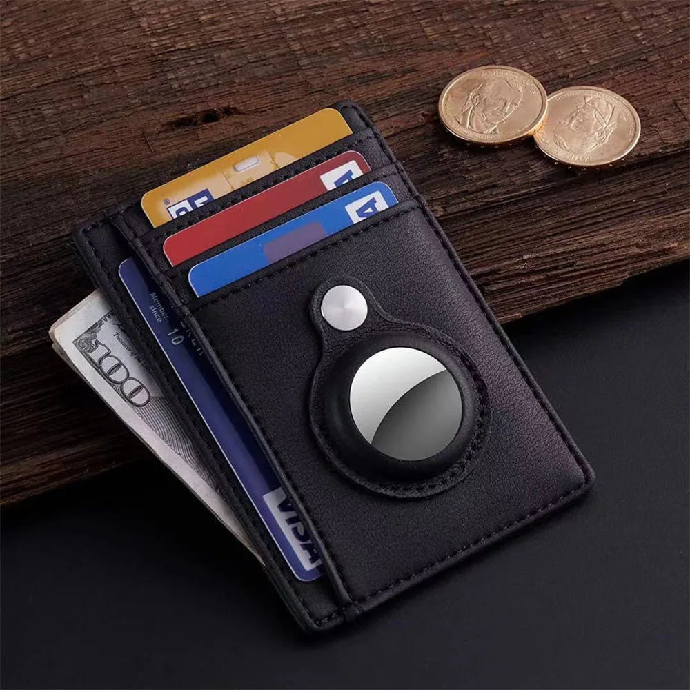 A dark gray RFID blocking card holder wallet with various cards and a coin resting on a wooden surface.