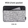 Black and white spotted laptop sleeve with a front pocket