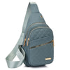 A slate blue quilted crossbody sling bag with a matching strap and gold hardware.